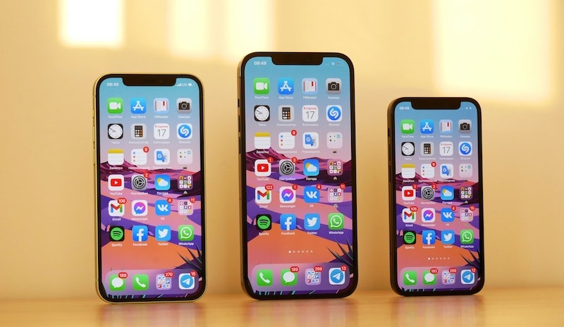 Three iPhones opened to the home screen