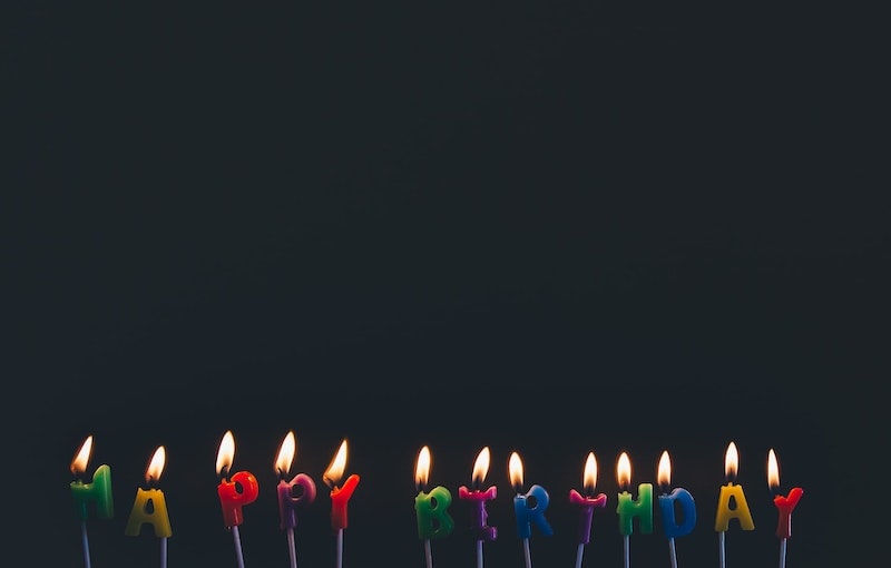 Birthday cake with lit candles